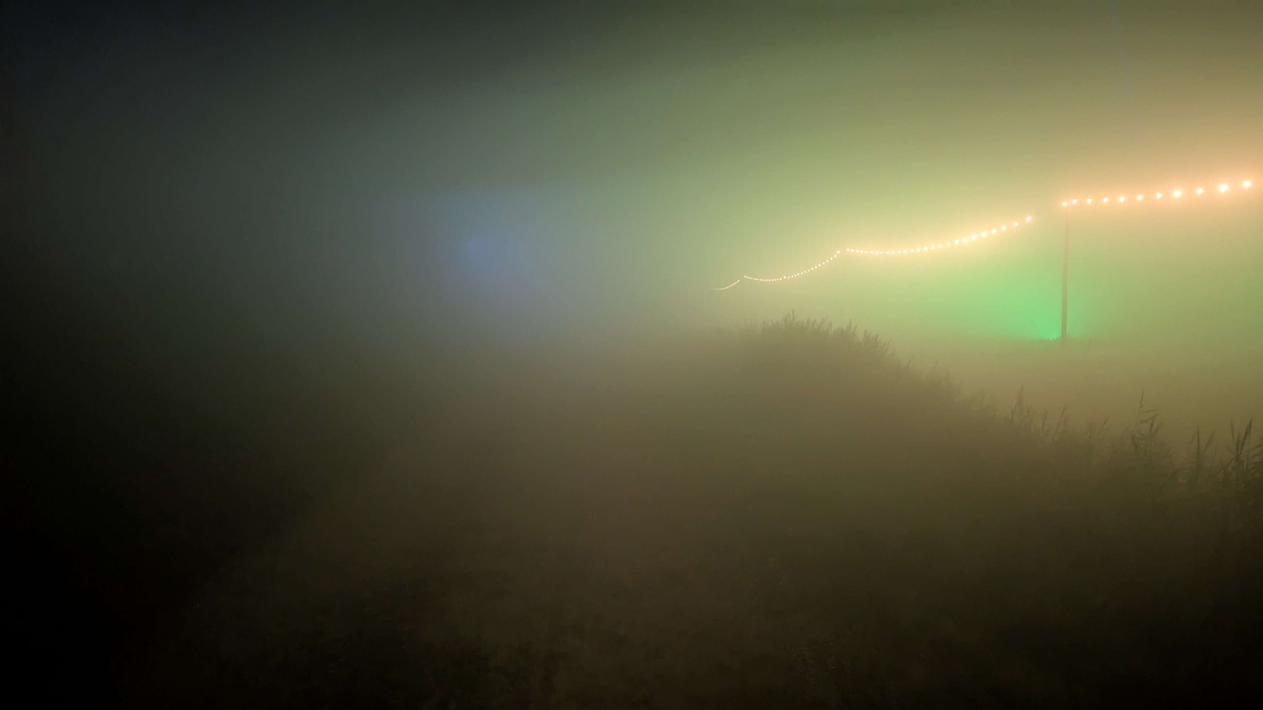 Fog so thick you can only see general shapes and big diffused spots of light
